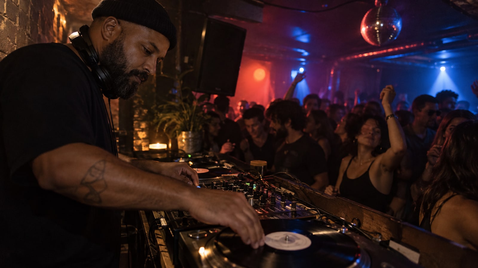 DJ booth and dancing crowd in a club